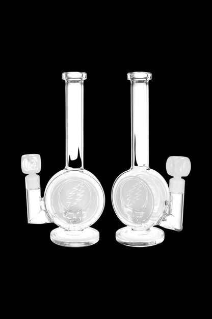 Two clear glass water pipes (bongs) against a black background.