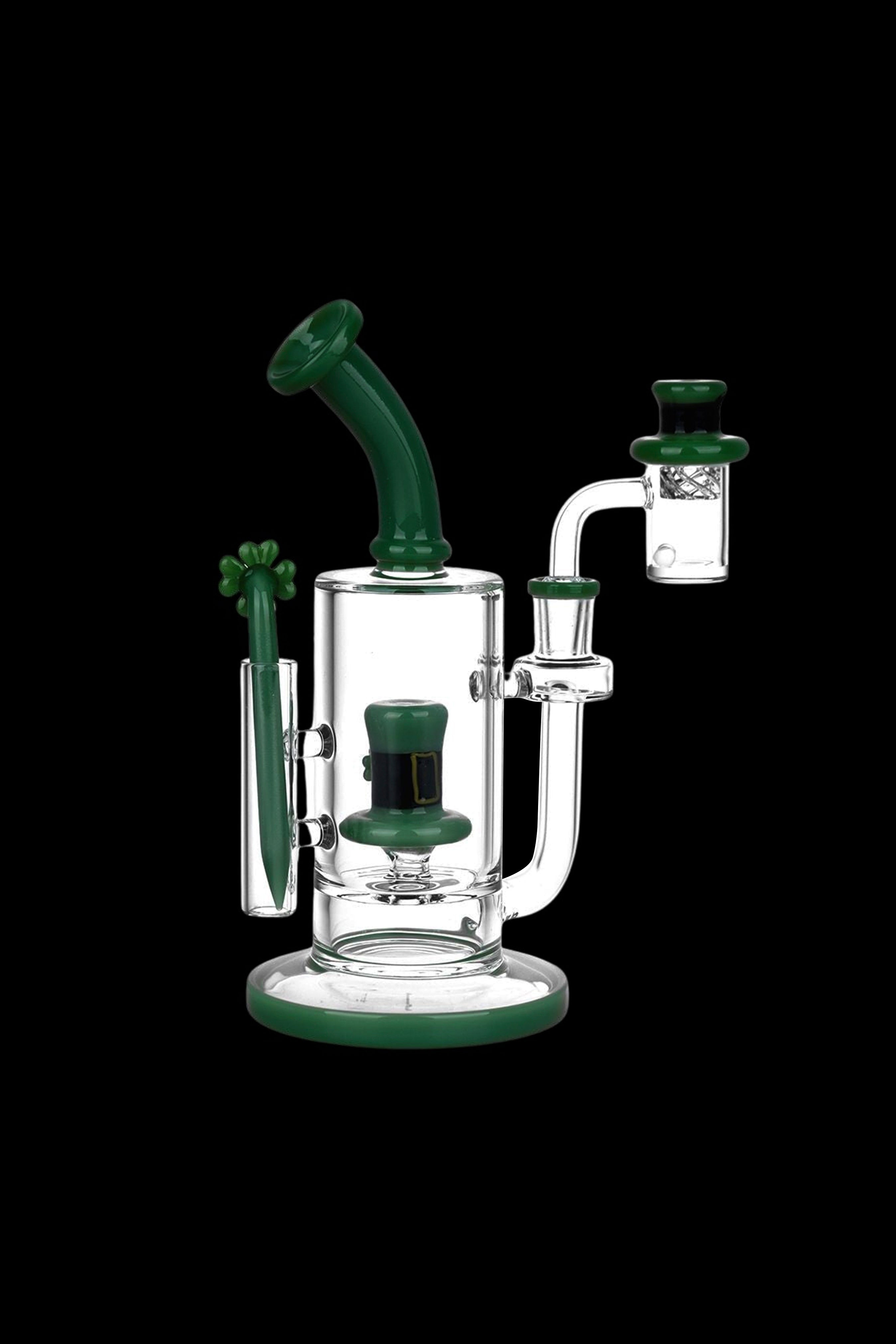 Green and white glass dab rig with a quartz banger.