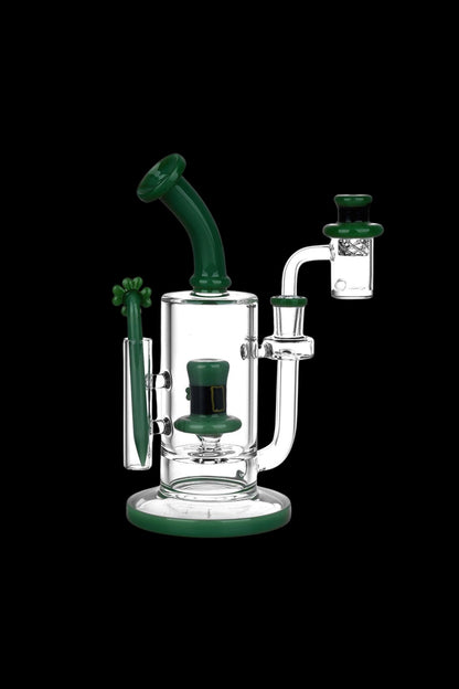 Green and white glass dab rig with a quartz banger.