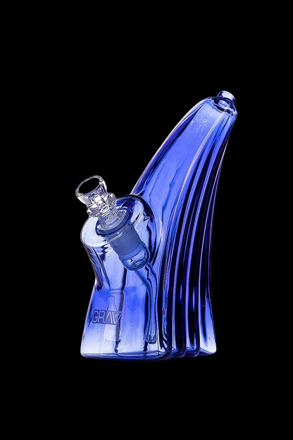 Blue glass water pipe with intricate wave-like design and clear mouthpiece.