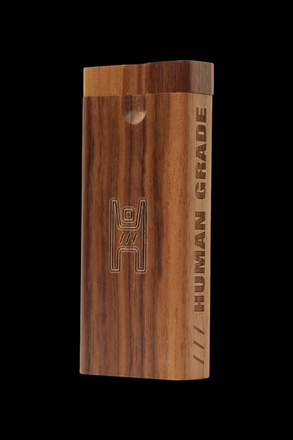Wooden dugout with “HUMAN GRADE” branding, used for storing and smoking cannabis.