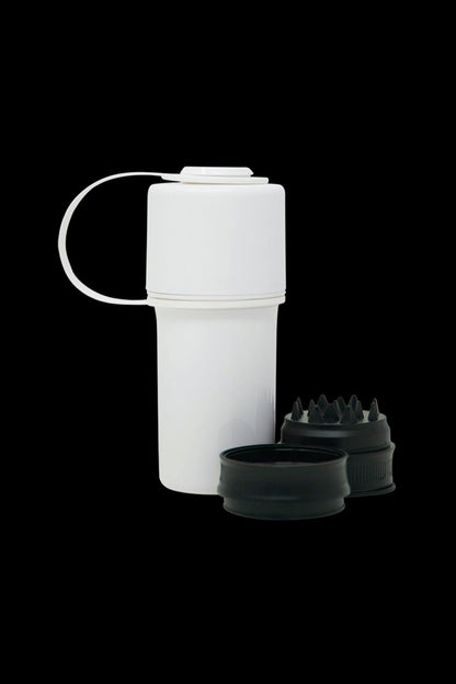 White grinder with removable internal grinding components and collection chamber.
