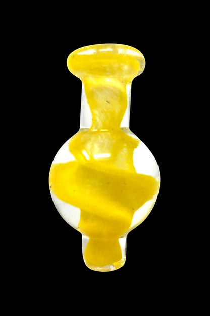 Yellow glass dab cap for cannabis concentrates.