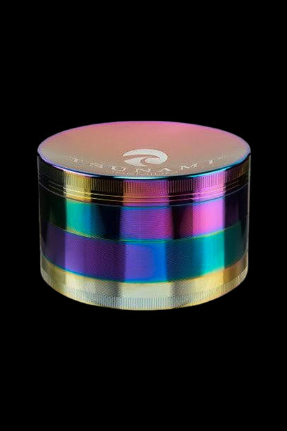 Iridescent metal cannabis grinder on a black background.