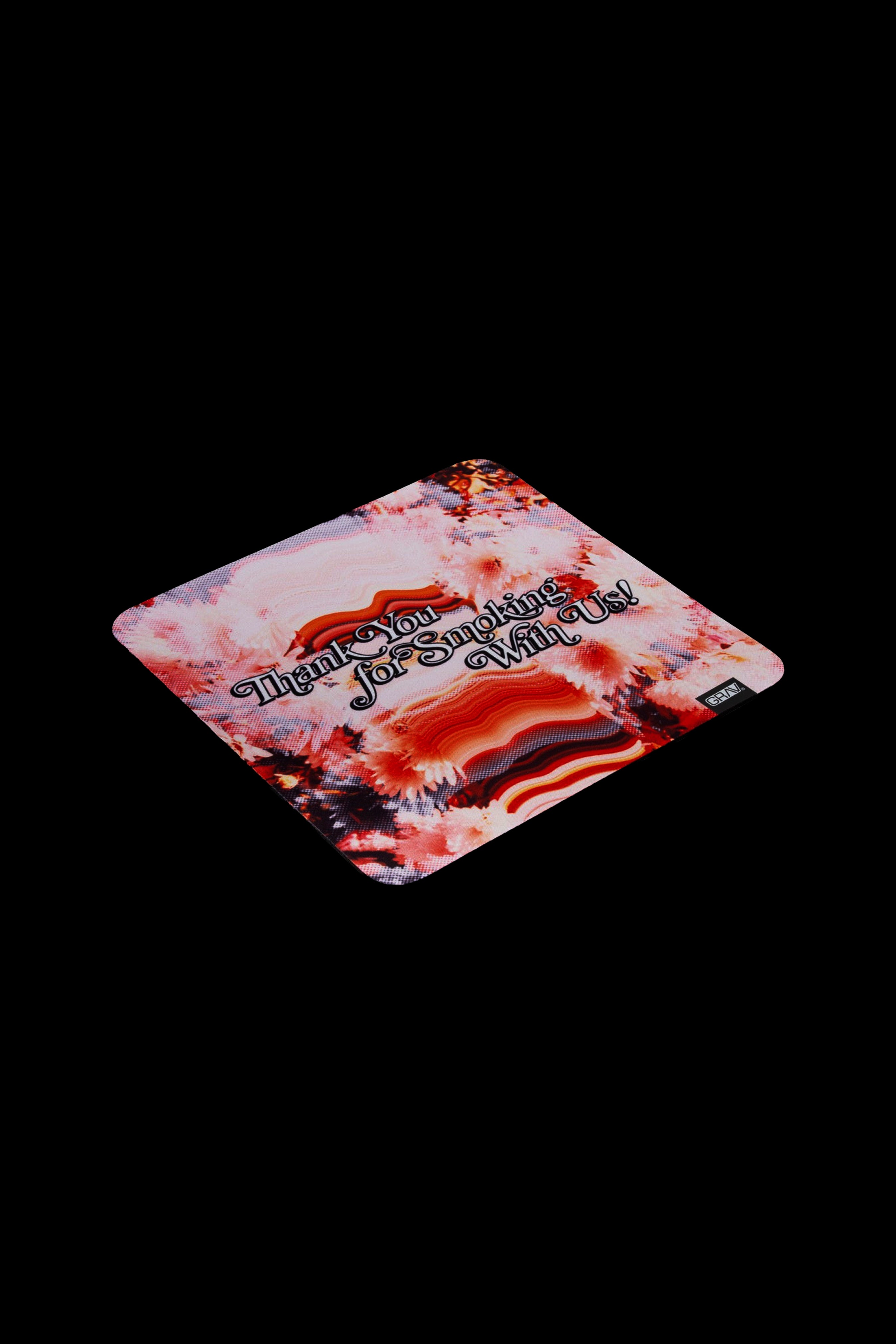 Close-up of a patterned rolling tray with the text “Thank You For Smoking With Us.”