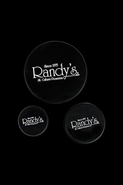 Black ashtrays displaying the white “Randy's – Since 1975 – Alt. Culture Pioneers” logo.