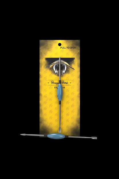Cannabis dab tool in yellow packaging with bee imagery and "Honey Herbs" branding.