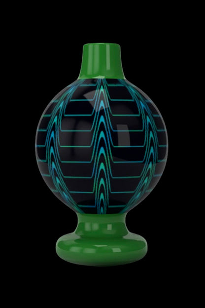 Green glass cannabis oil rig carb cap with blue wavy pattern.