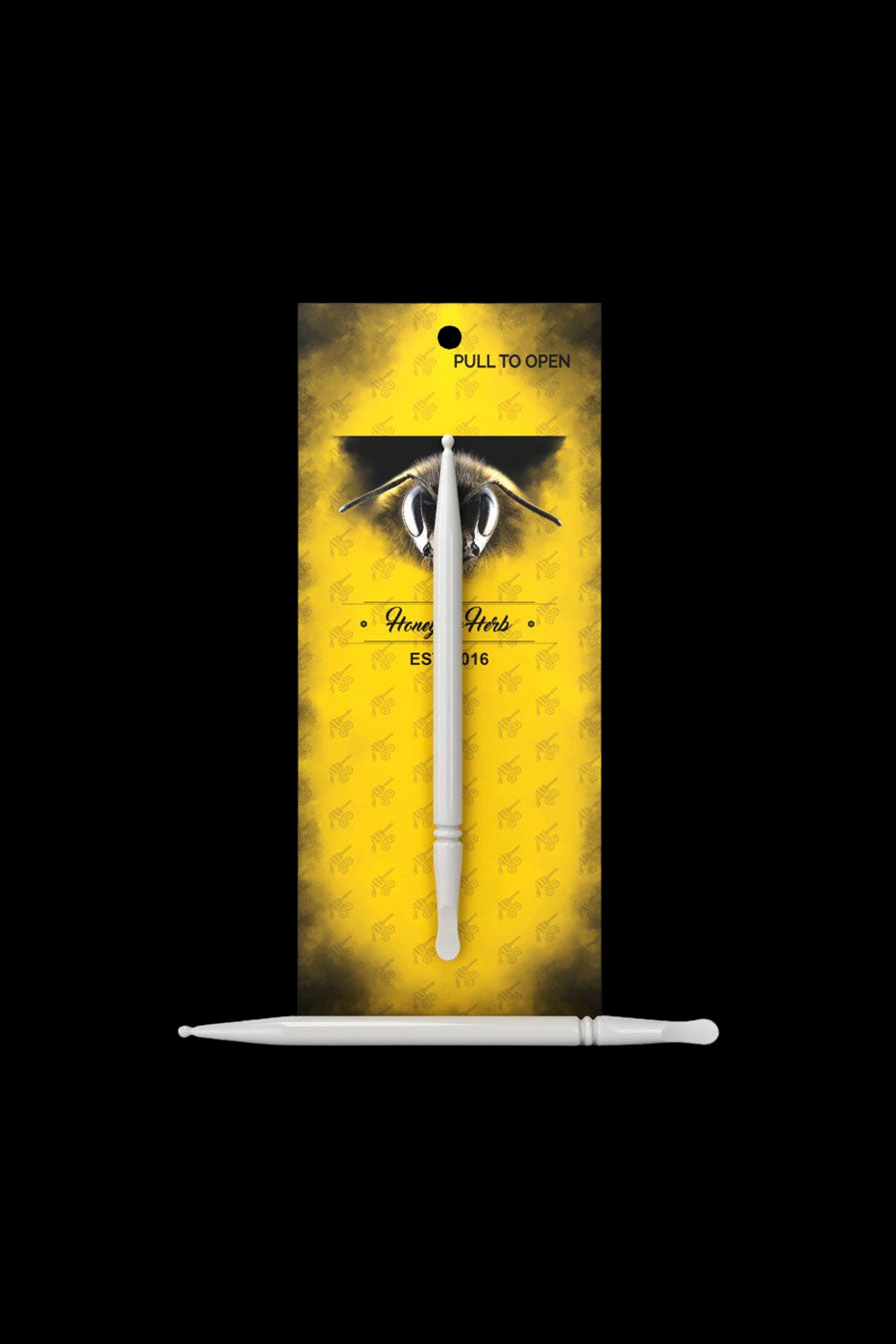 A gold package displaying a silver cannabis dab tool with a bee illustration and text reading "Honey Nectar ES 016".