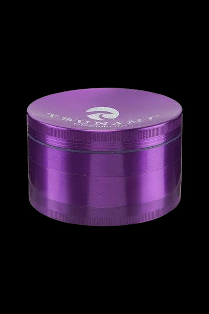 Purple four-piece metal grinder for cannabis.