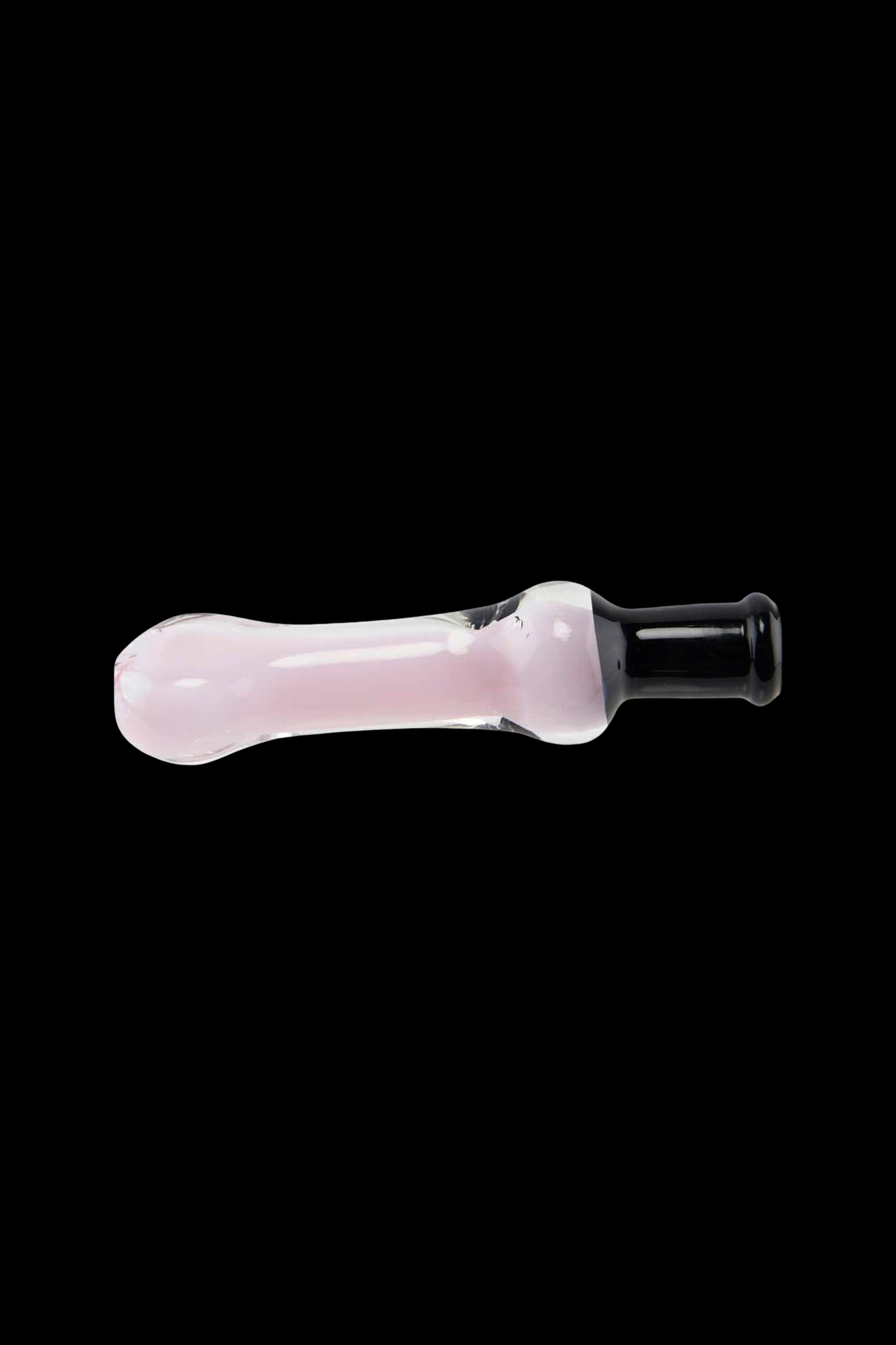Pink glass pipe for smoking cannabis, isolated on a black background.