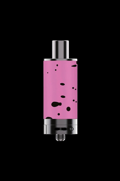 Pink cannabis dab rig with metallic accents against a black background.