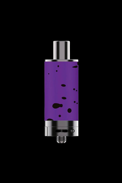 Purple cannabis concentrate vaporizer pen against a black background.