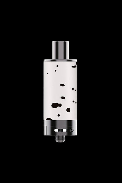 Silver cannabis oil vape cartridge with black speckles, isolated on a black background.
