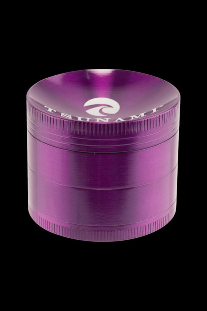 Purple four-piece metal grinder for cannabis.
