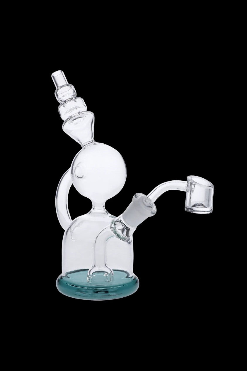 Clear glass dab rig with a green base and quartz banger.