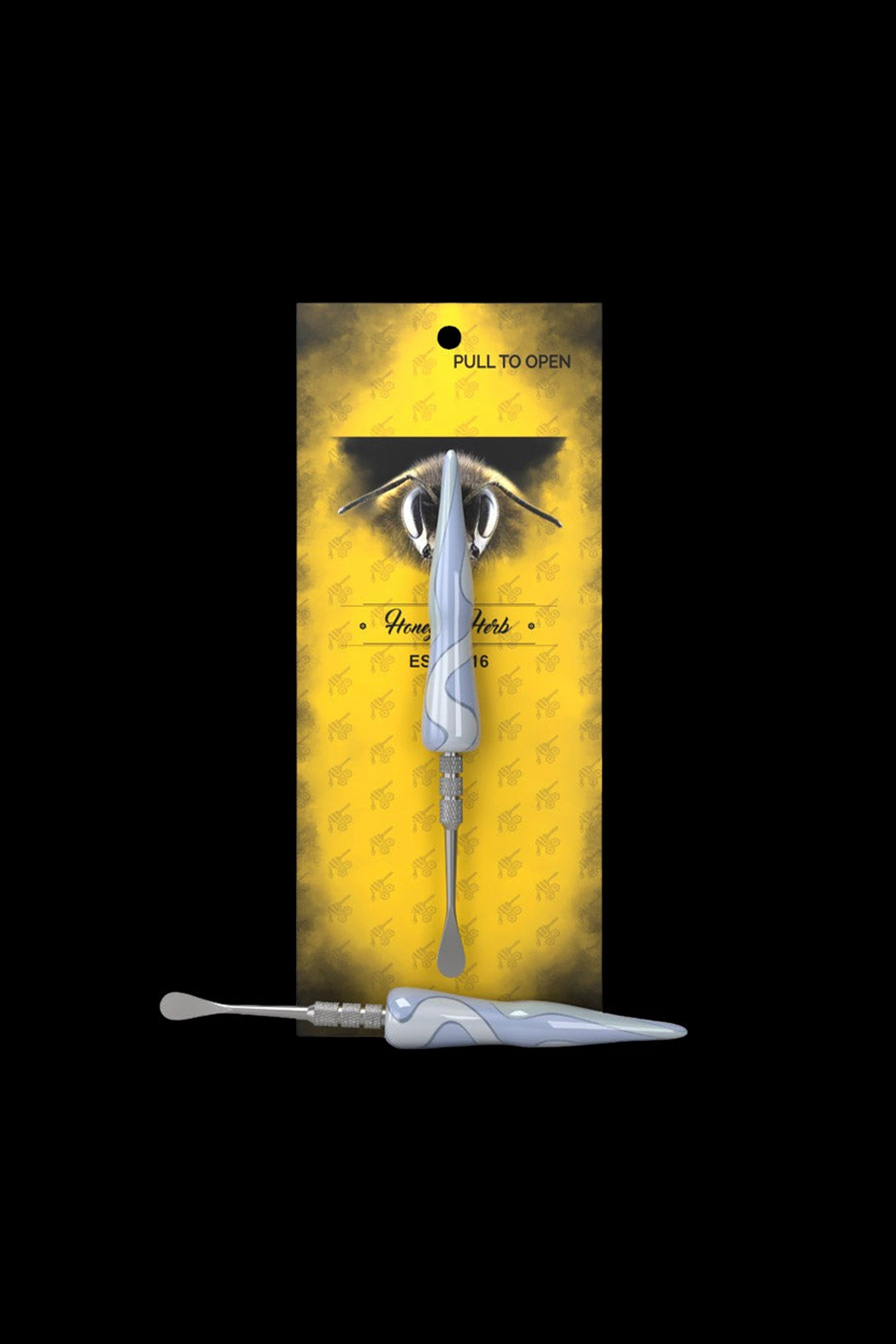 A packaged cannabis dab tool with a bee-themed design.