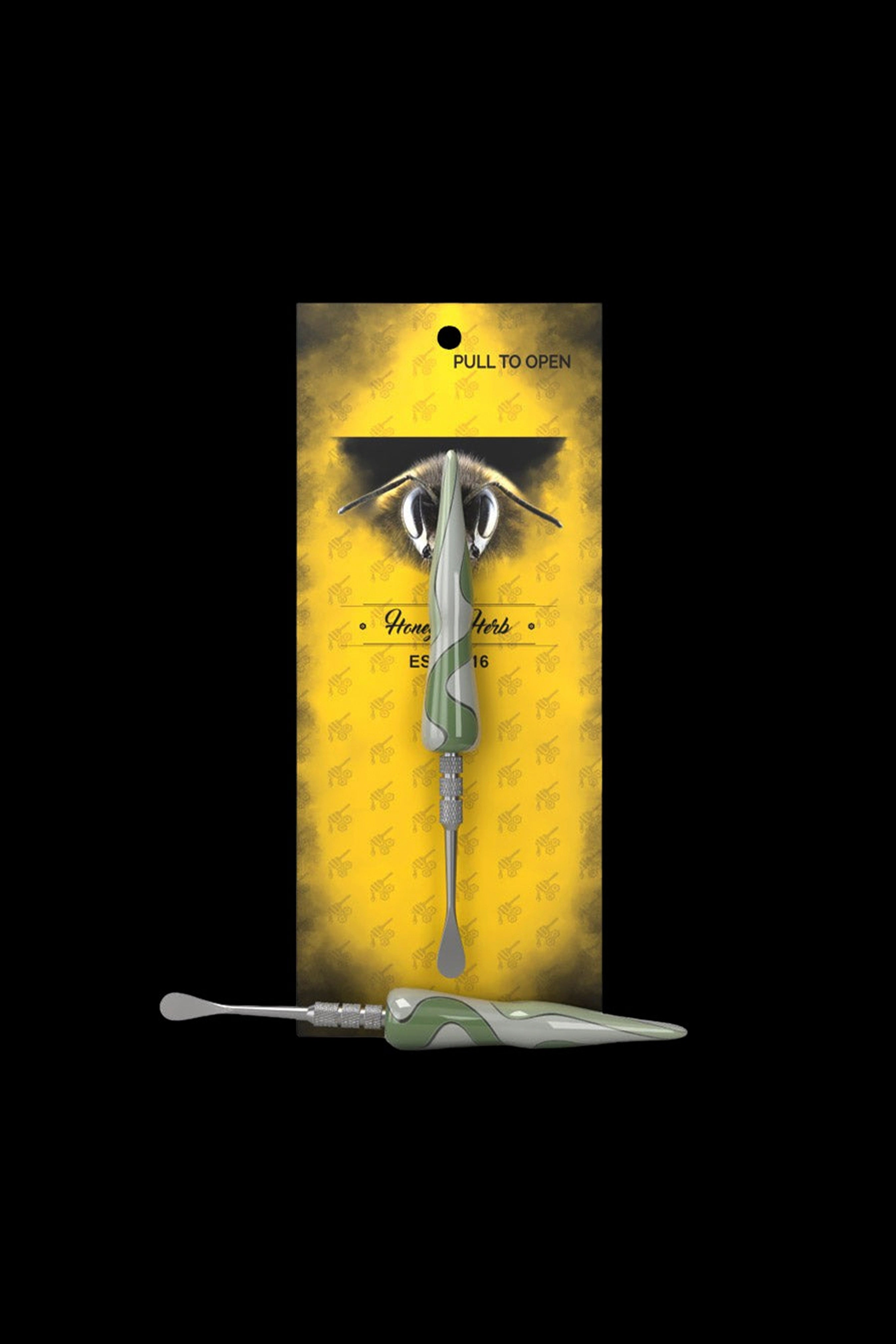 A packaged cannabis dab tool with a bee-themed design.