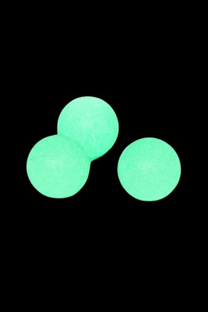 Three glowing green spheres arranged in a triangular cluster on a black background, The Stash Shack Glow in the Dark Quartz Terp Pearls - 2pc