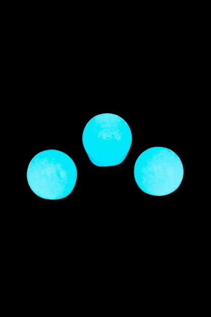 Three glowing turquoise spheres arranged in a triangle on a black background, the Stash Shack Glow in the Dark Quartz Terp Pearls - 2pc.