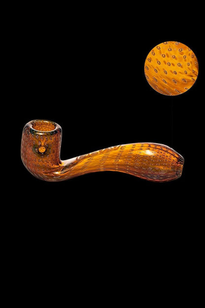 Orange speckled glass pipe with a rounded bowl, displayed against a black background.