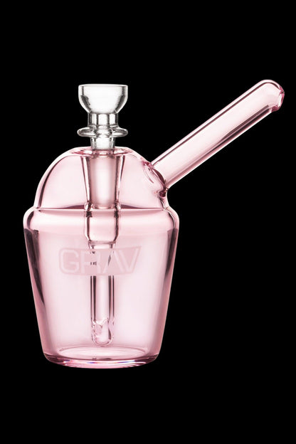 Pink glass bubbler with a cylindrical mouthpiece and intricate internal diffusion.