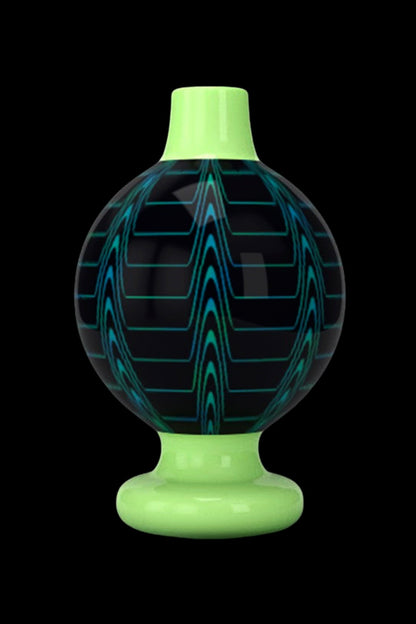 Glowing green glass dome for a cannabis dab rig.