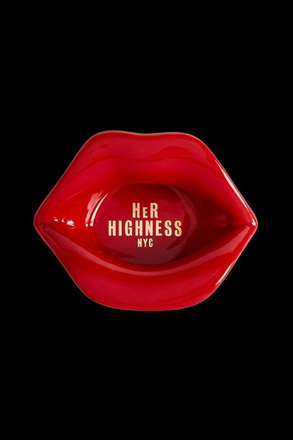 Red, glossy lips shaped as an ashtray with “Her Highness NYC” text inside, against a black background.