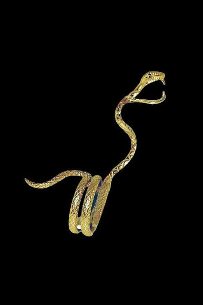 Golden snake-shaped glass pipe with a bowl, isolated on a black background.
