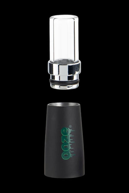 Black and clear glass oil rig dab attachment with green logo.