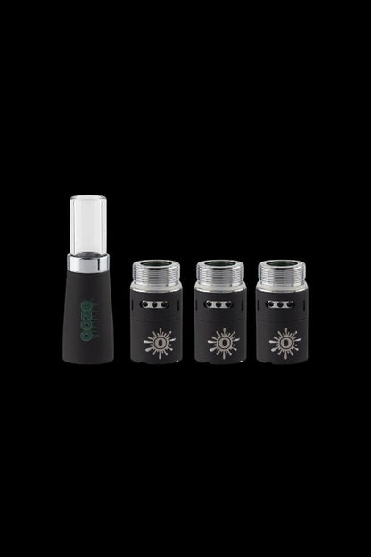 Black cannabis oil cartridges and a charging base on a dark background.