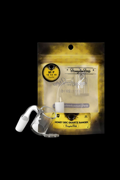 Honeybee Herb’s packaging displays a quartz banger for vaporizing concentrates, with branding and product details visible.