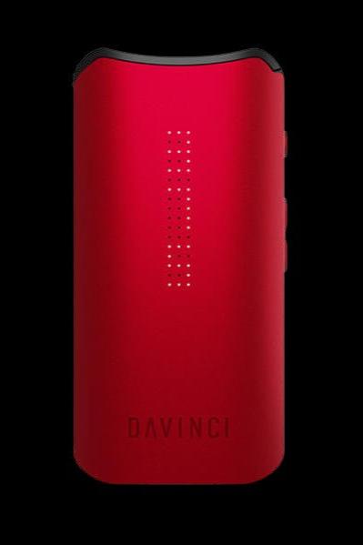 Red Davinci vaporizer with illuminated dots, displaying the brand name.