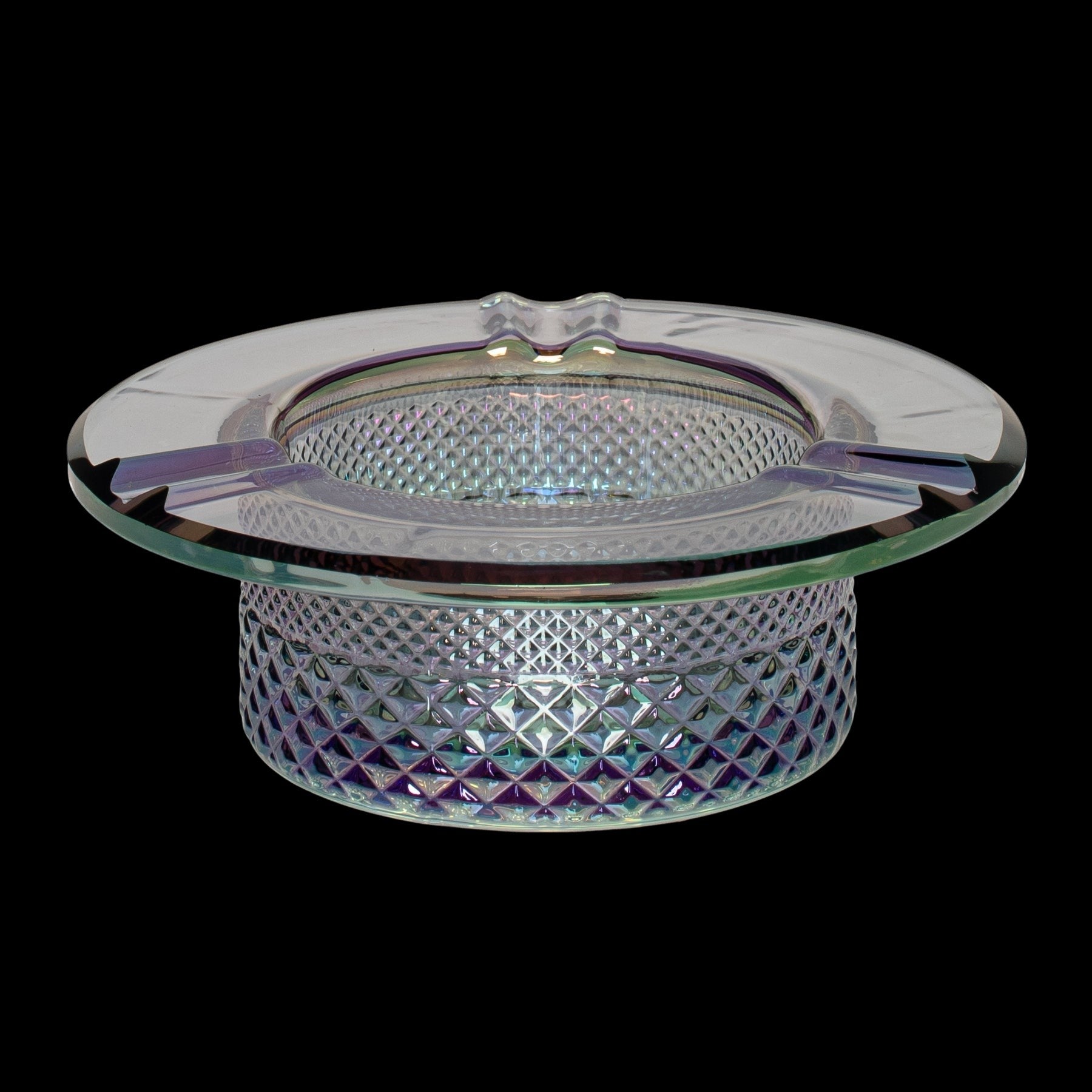 Iridescent glass ashtray with a geometric, cut-glass pattern.