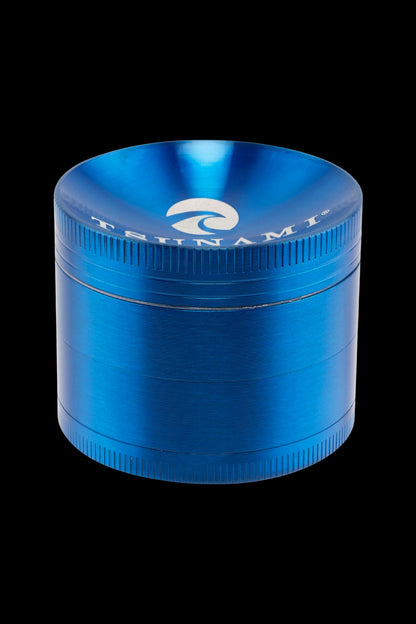 Blue metal cannabis grinder with a branded logo.