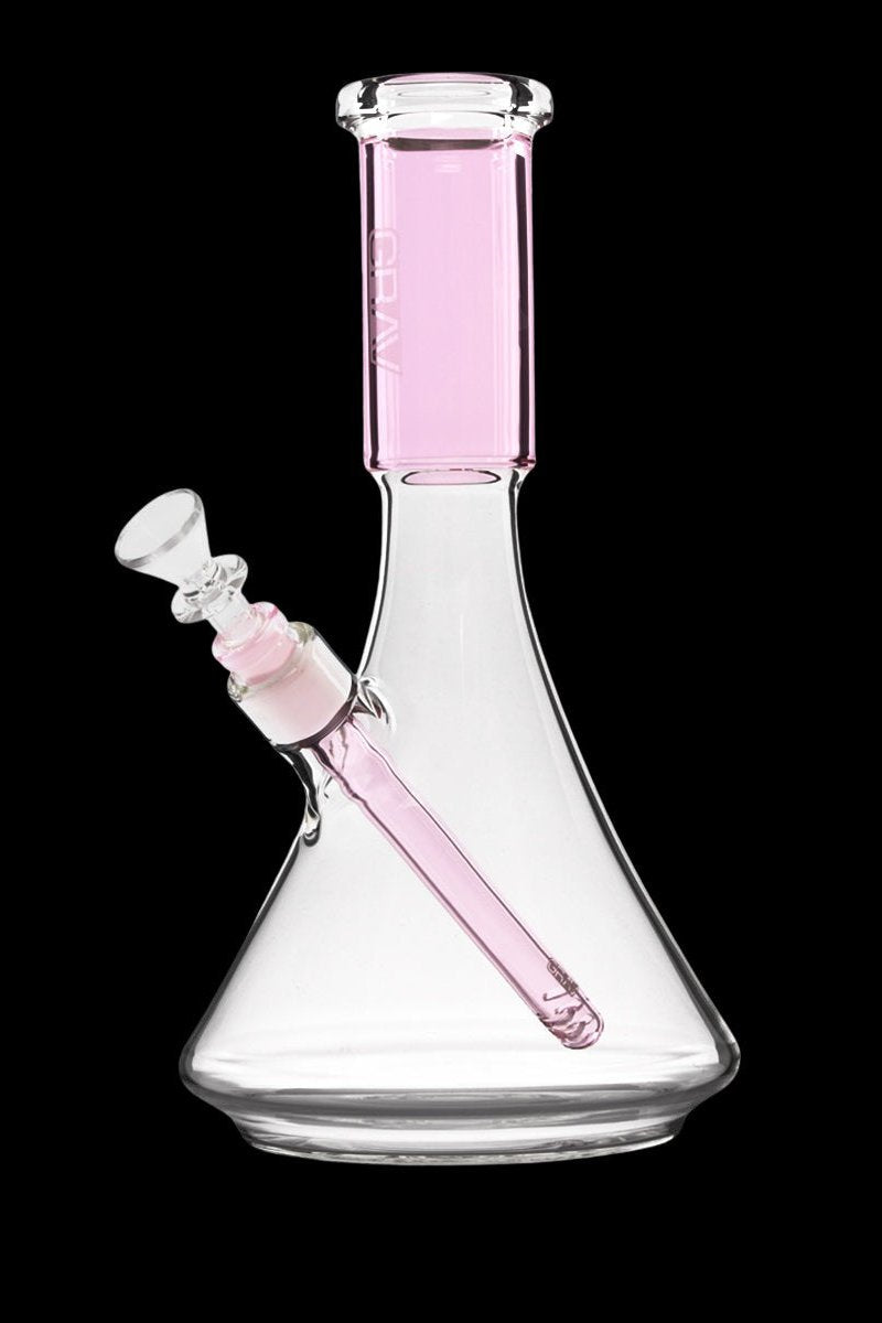 Pink glass beaker bong with ice catch and downstem.
