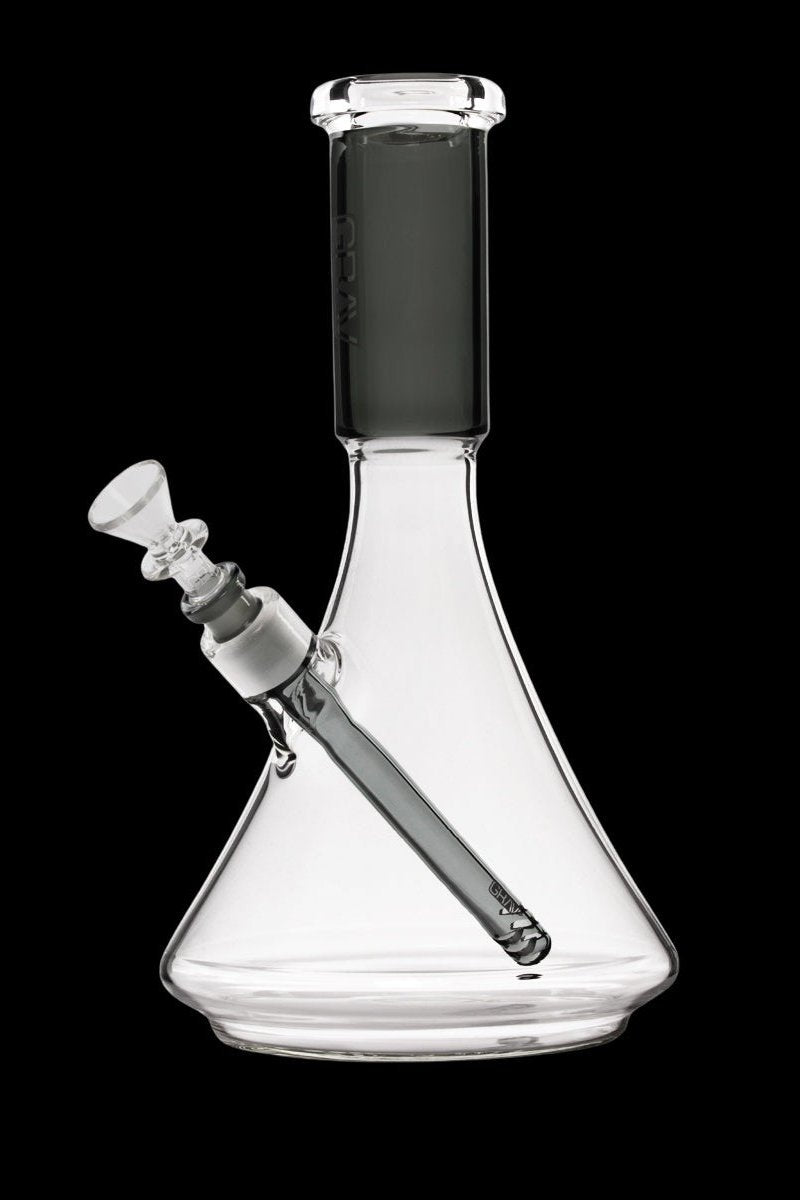 Clear glass bong with a downstem and bowl, isolated on a black background.