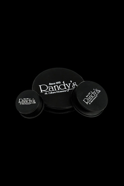 Three black containers with the “Randy’s” logo and “Since 1975 – Alt. Culture Pioneers” text on a black background.