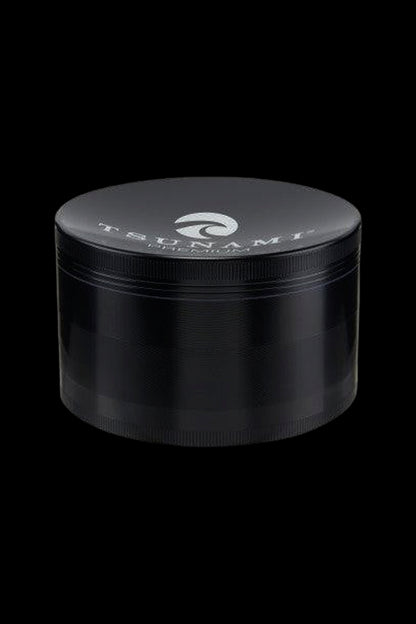 Black four-piece cannabis grinder with branded logo.