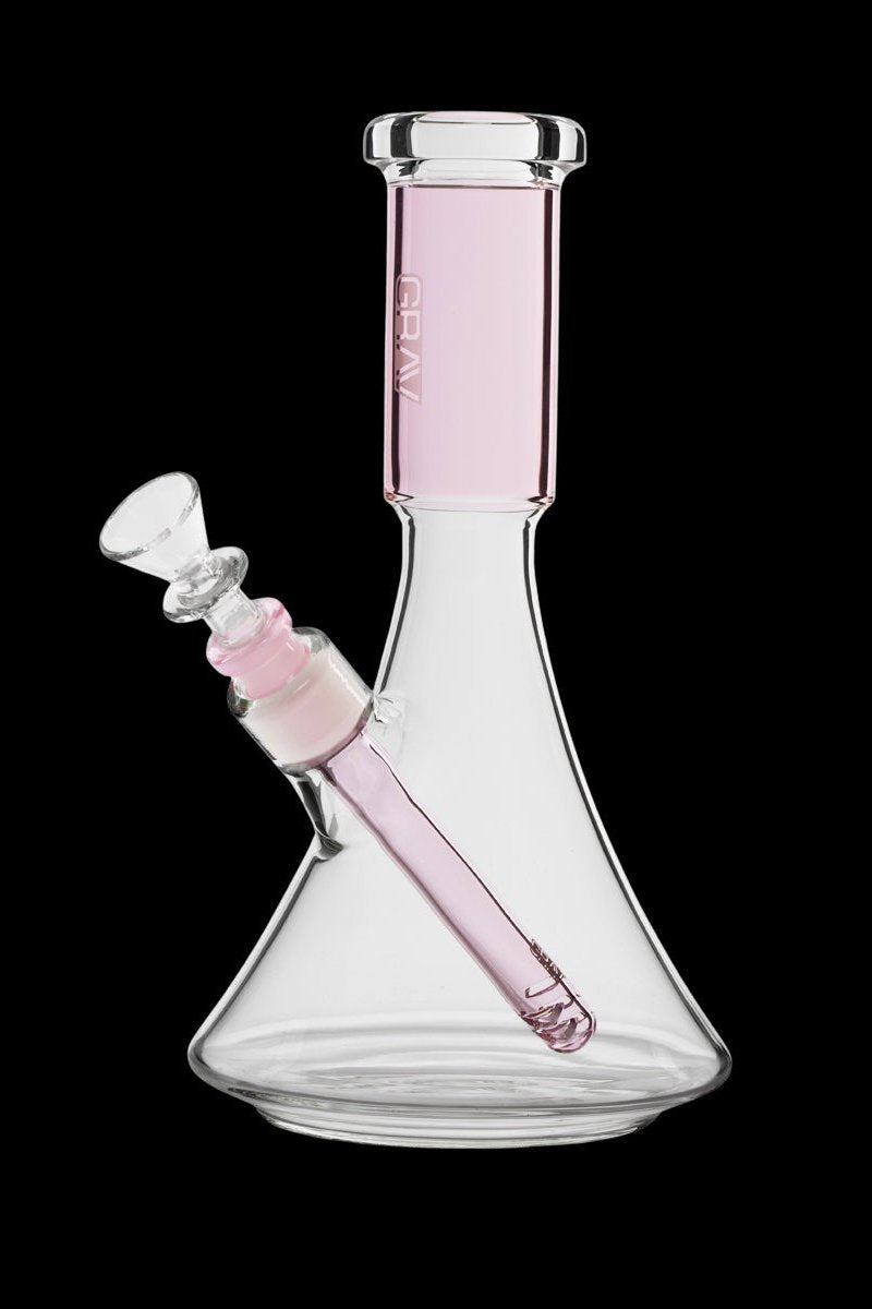 Pink glass bong with a downstem and bowl, isolated on a black background.
