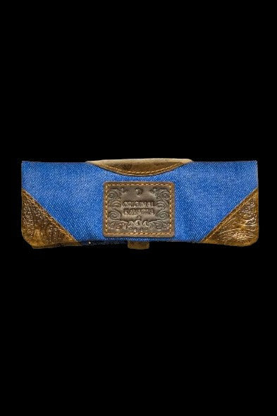 Denim cannabis smell-proof case with embossed leather detailing.