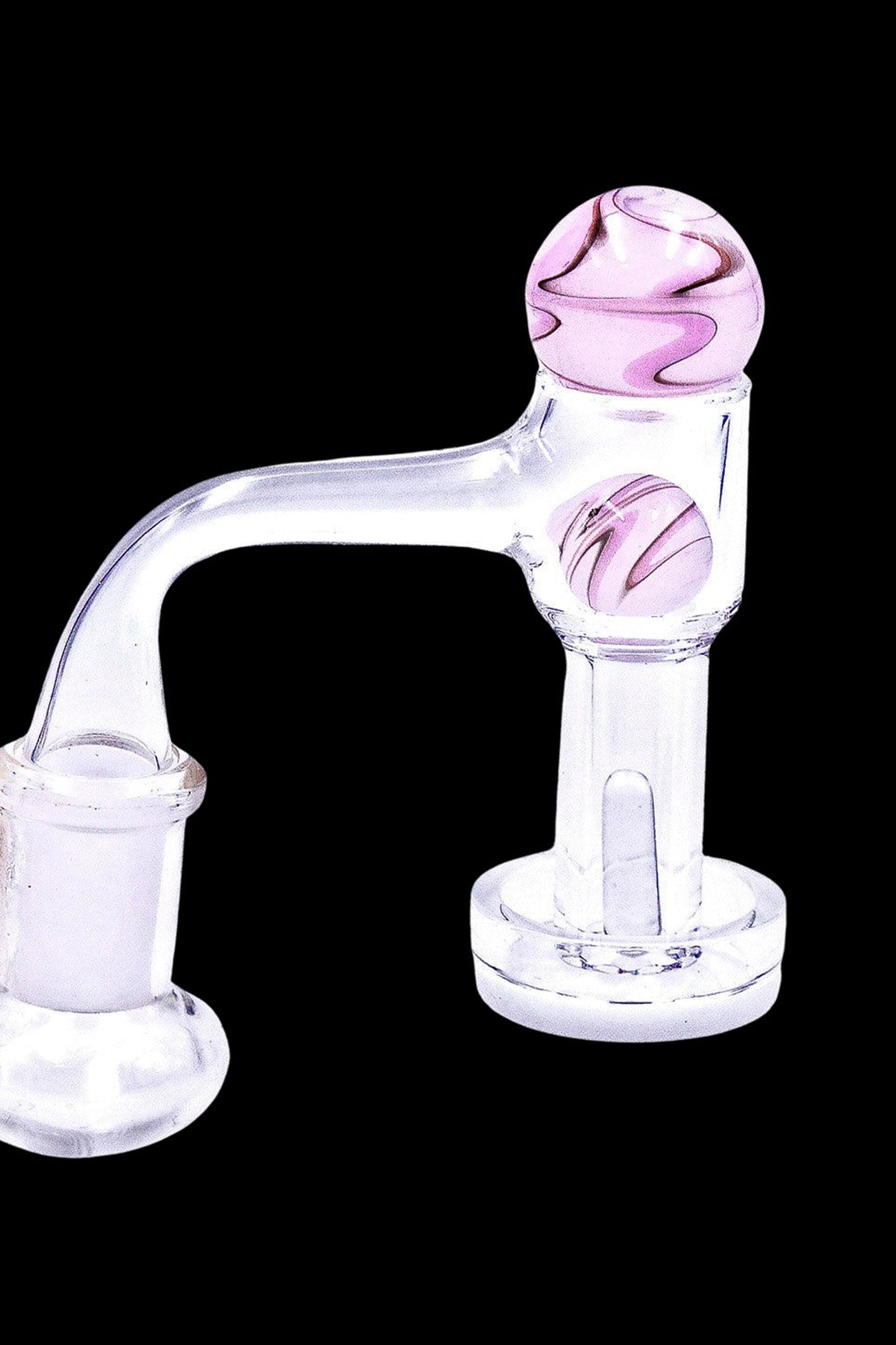Glass cannabis water pipe with pink and white marbled spheres.