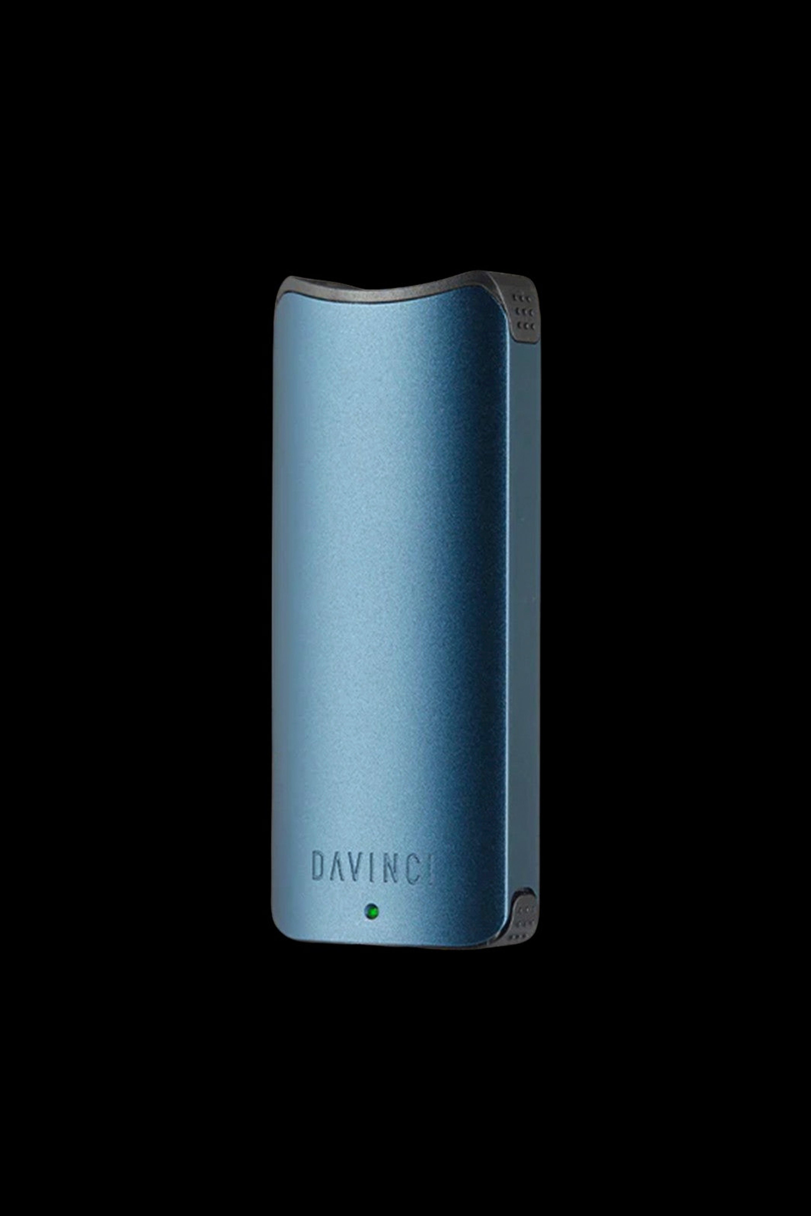 Blue DaVinci IQ2 vaporizer against a black background.
