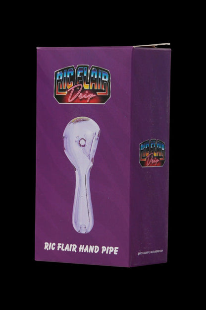Pink glass hand pipe with “Ric Flair Drip” branding in a white box. <start_of_image>