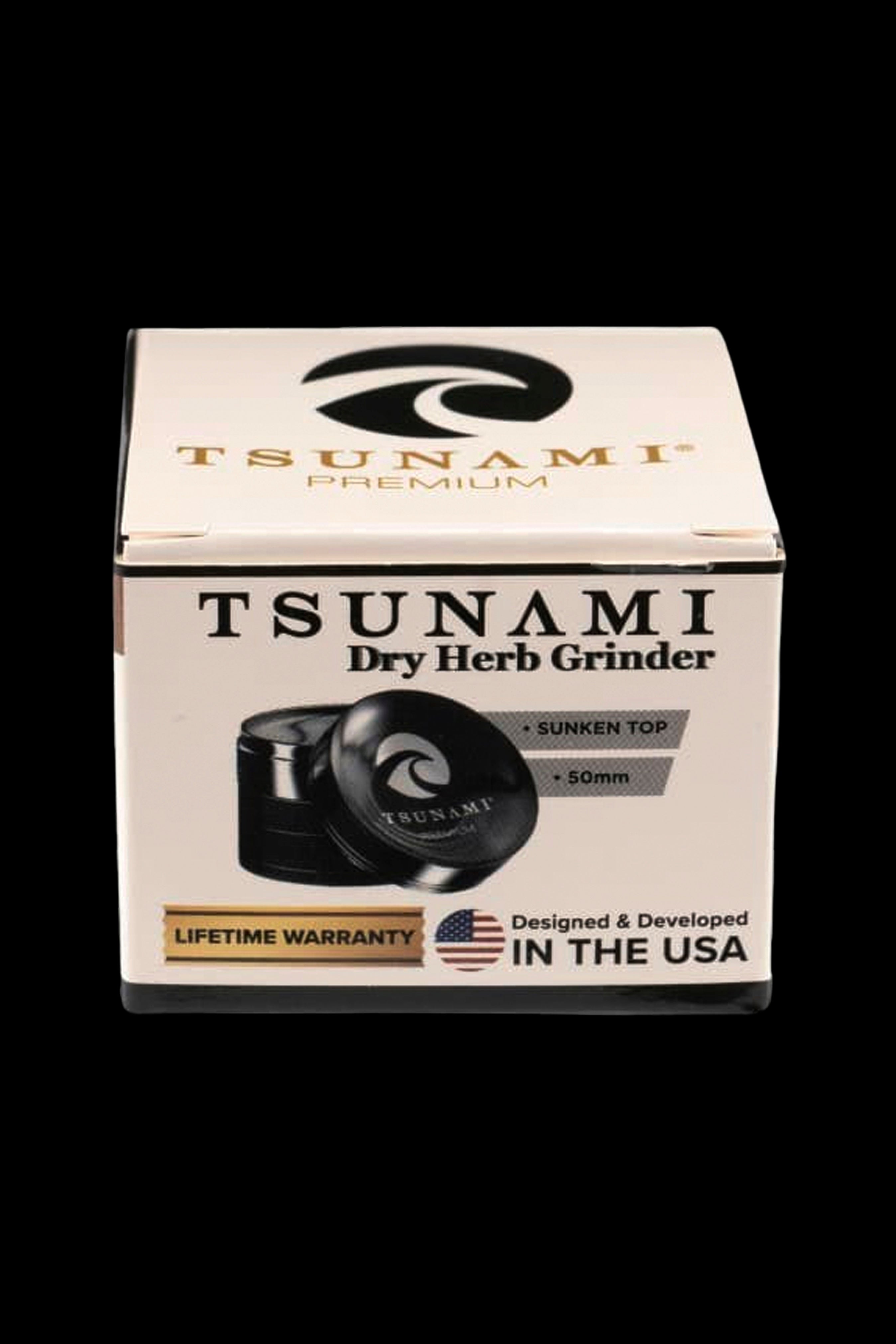Box for a Tsunami Premium Dry Herb Grinder, featuring a product image and details like "50mm" and "Lifetime Warranty."