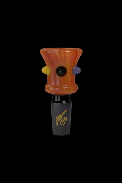 Hand-blown glass cannabis accessory with orange and purple swirl design.