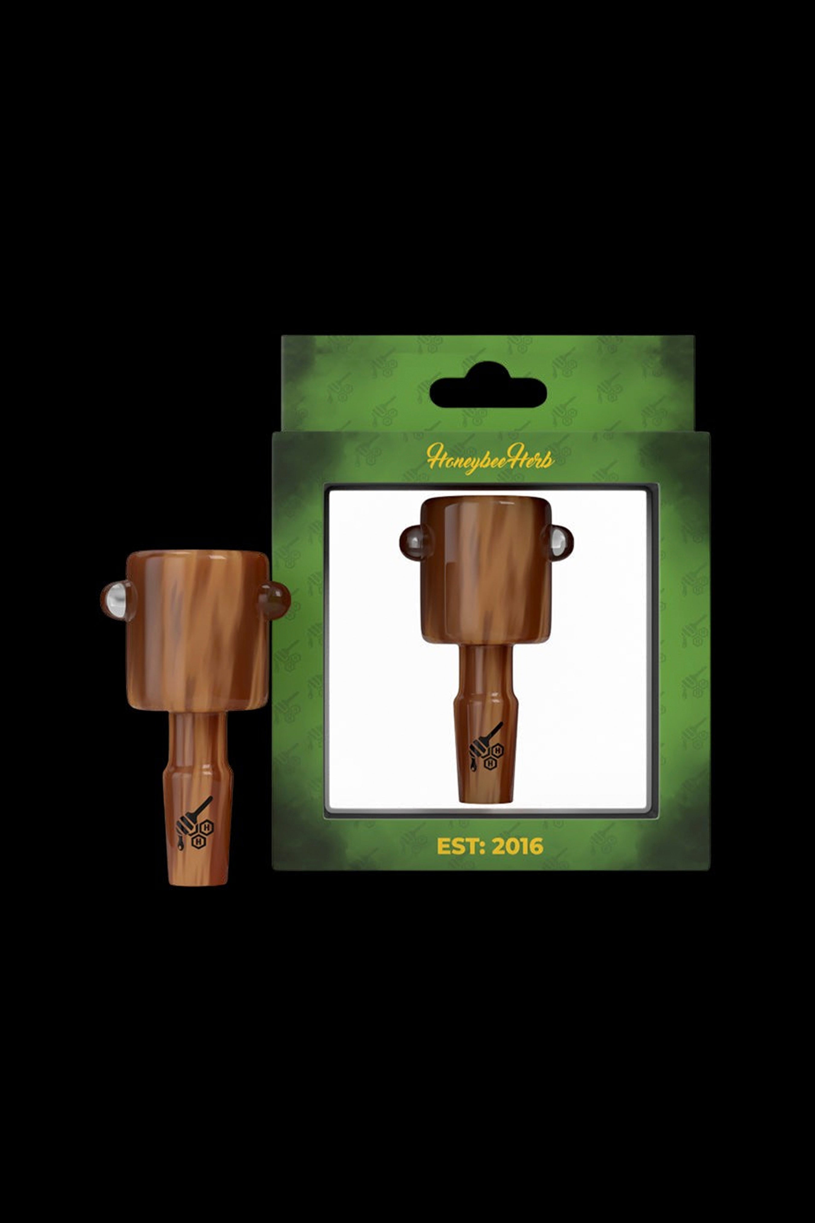 Wooden cannabis oil burner packaged on a green card with “Honeybee Herbs” and “EST. 2016” text.