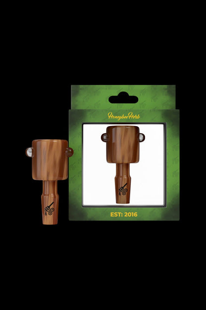 Wooden cannabis oil burner packaged on a green card with “Honeybee Herbs” and “EST. 2016” text.