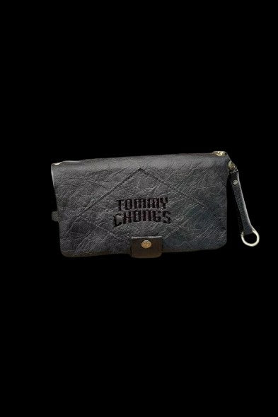 Black zippered pouch with "Tommy Chong's" embossed on the front, against a black background.