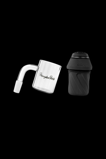 Puffco Peak atomizer and glass water pipe with "Honeybee Herbals" branding, isolated on a black background.